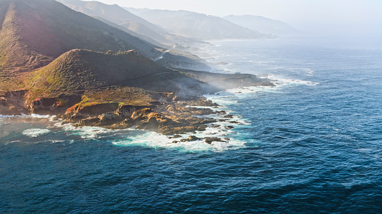 Aerial view of waves breaking on Soberanes Point at Garrapata State Park in Carmel-by-the-Sea, California, USA.