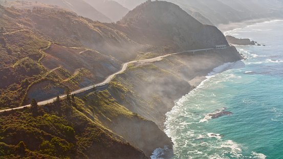 Aerial view of Limekiln State Park with coastal highway during sunny day, Big Sur, California, USA.