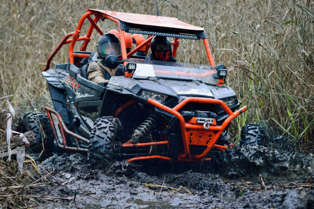 istock Offroad extreme vehicle racing with mud splash. ATV, buggy, quad, UTV, 4x4 1576017111