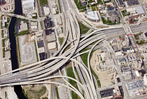 Aerial view of a large interstate highway interchange in the downtown area of Milwaukee, Wisconsin. This is the Marquette Interchange (I-94, I,43 and I-794).Shot from the open window of a small airplane. 