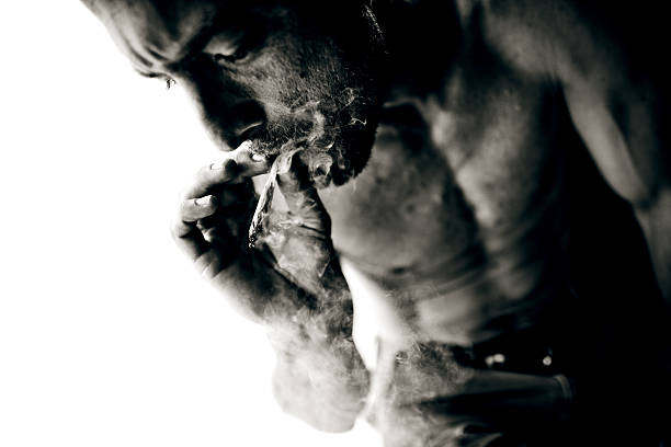 istock Young man smoking tobacco 157602217