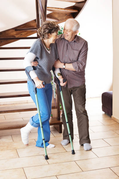 istock Woman with broken leg and crutches 157602306