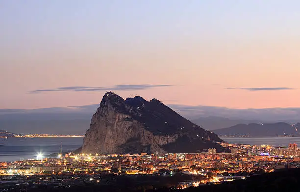 The Rock of Gibraltar and spanish town La Linea at night