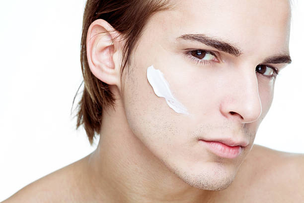 istock Man with cosmetic cream on face 157602669