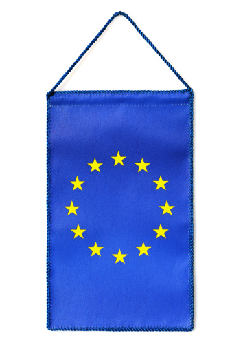 Hanging European table flag isolated on white.