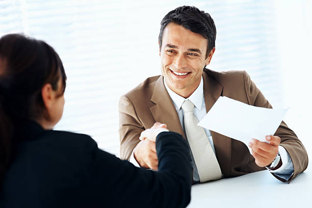 istock Hiring - Friendly business man shaking an employee's hand 157602723