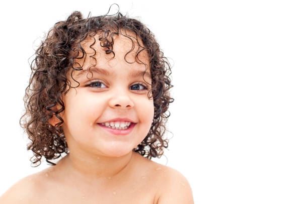 Happy child smiling against white background Royalty free stock photo of child ,aged 3 years old, laughing while having a bath. Shot against white background. girls bath stock pictures, royalty-free photos & images