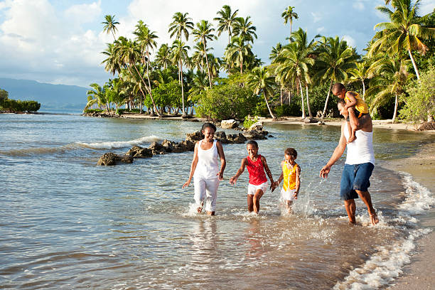 Fijian Family Playing on The Beach stock photo