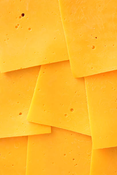Cheddar slices Top view of cheddar cheese slices cheddar cheese photos stock pictures, royalty-free photos & images