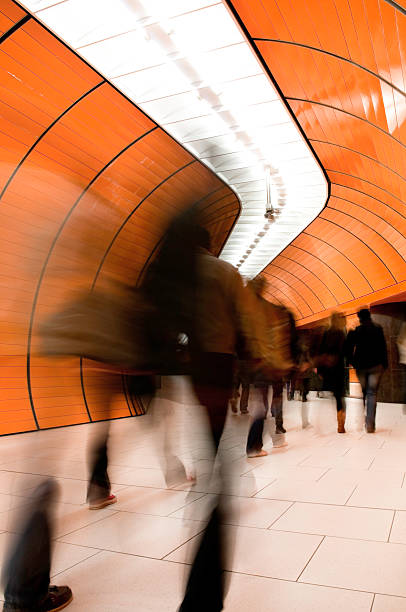 istock Rush hour in busy subway tunnel, people rushing by 157603399