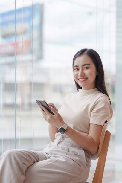 istock Beautiful Businesswoman completes KYC using an online banking program in order to open a digital savings account. The definition of cyber security 1576034755