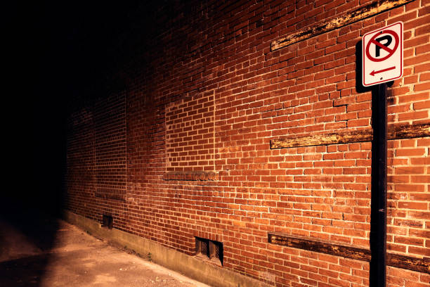 istock No parking sign leading to dark alley 157603679