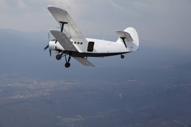 istock Old Biplane flying in the Sky 157603842