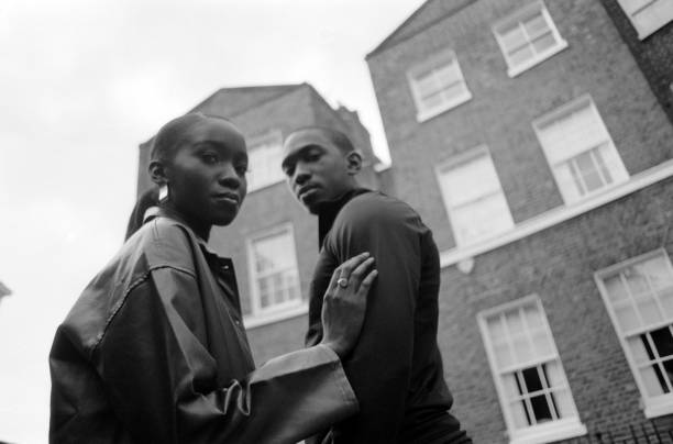 istock Twins posing in the street. 1576039528