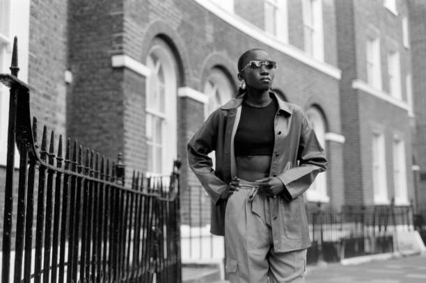 istock Black female model posing in the street. 1576039532