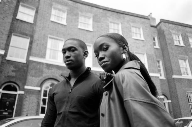 istock twins posing in a London street. 1576039534