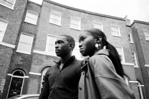 istock Twins in the street looking away. 1576039538