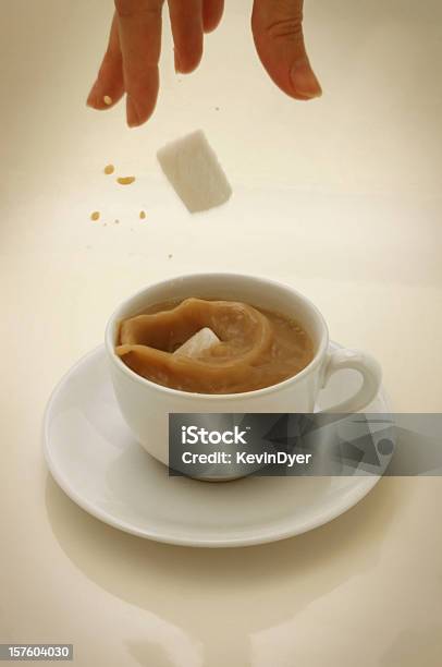 Sugar Lumps Falling Into A Cup Of Tea Stock Photo - Download Image Now - Falling, Sugar - Food, Activity