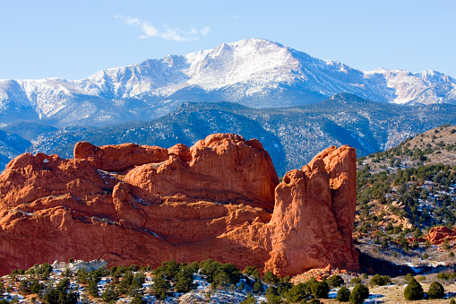 Snow covered Garden of the Gods Park in Colorado Springs at the base of 14000 foot Pikes Peak in the wintertime.