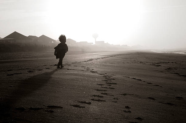 istock Nostalgic image of a toddler running on the beach 157605660