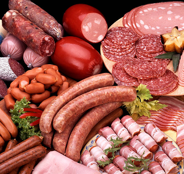 Assortment of cold meats A variety of processed cold meat products. baloney photos stock pictures, royalty-free photos & images
