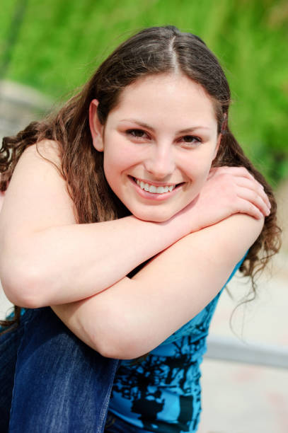istock Smiling pretty young woman in sunny day 157605719