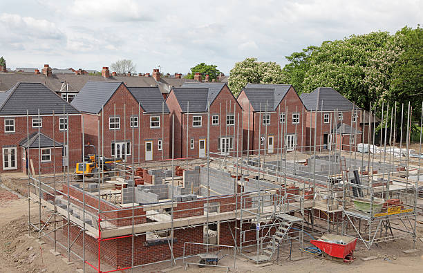 elevated view of a uk building site ariel view of new houses being built. housing development photos stock pictures, royalty-free photos & images