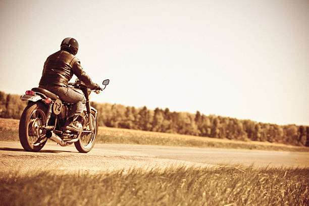 vintage motorcycle ride - riding old old fashioned motion fotografías e imágenes de stock