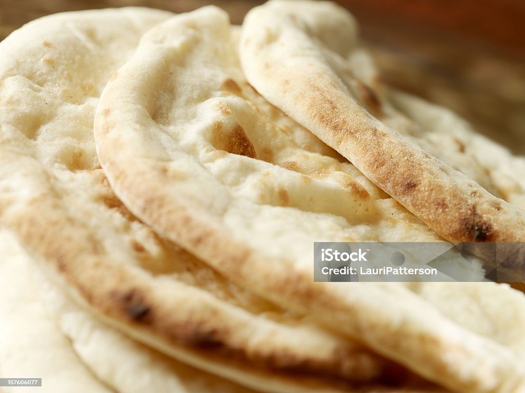 East Indian Naan Bread East Indian Naan Bread -Photographed on Hasselblad H1-22mb Camera Naan Bread Stock Photo