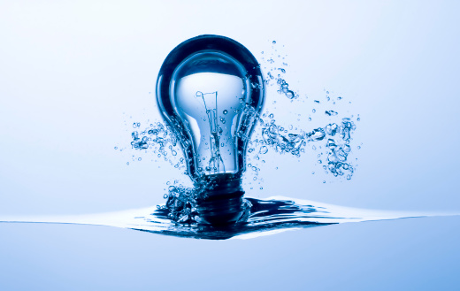 Light bulb splashing into water. Concept image for Ideas / Innovation.