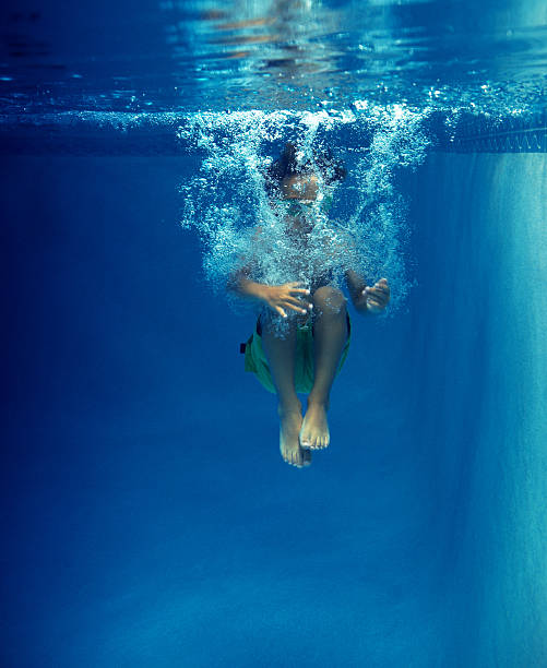 istock kid having a good time in the pool 157606492