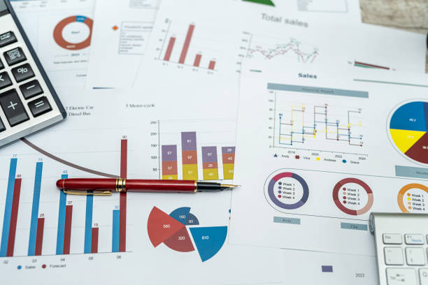 istock many business charts and graphs on office desk 1576066871