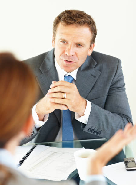 istock Businessman discussing with his colleague in office 157606841