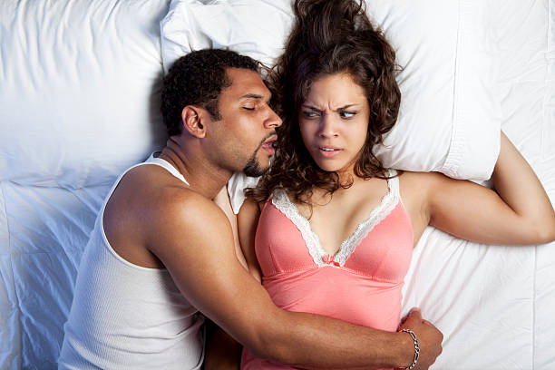 Snoring Husband  bad breath couple stock pictures, royalty-free photos & images