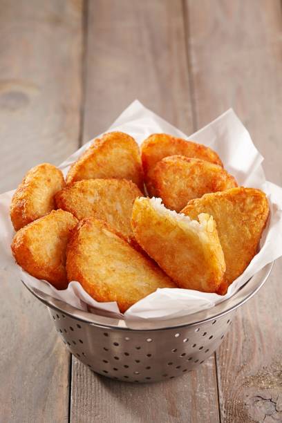 istock golden hash brown is served in a stainless bowl 1576073276