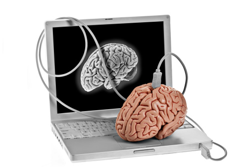 A human brain about to be plugged into a computer on a white background. Concept for man machine interface. Available in XSmall to XXXLarge.PLEASE CLICK HERE FOR MORE BRAINS.