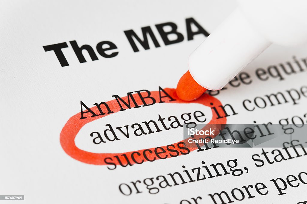 Red pen circles &quot;advantage&quot; in document headed MBA.  Master of Business Administration Stock Photo