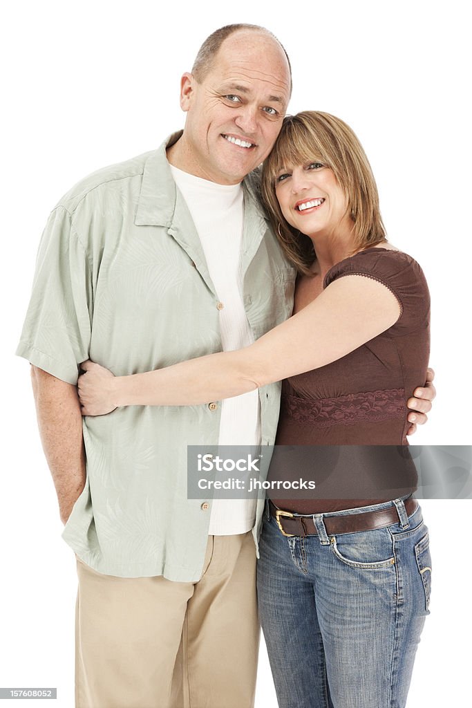 Attractive Mature Couple Portrait of an attractive mature couple, isolated against a white background. Embracing Stock Photo
