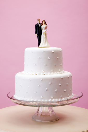 elegant wedding cake with vintage bride and groom figurine