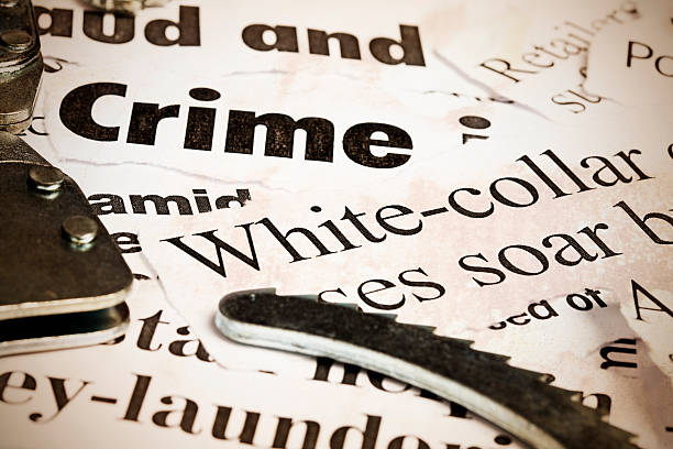 Close up of headlines on financial crime with handcuffs  ponzi scheme stock pictures, royalty-free photos & images