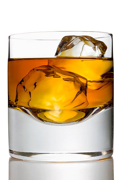 istock Whiskey with two ice cubes in a glass 157608382
