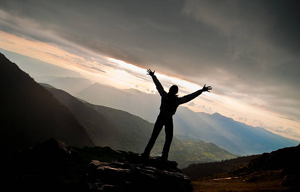istock Woman Silhouette against Spectacular Nature Sunset 157608565