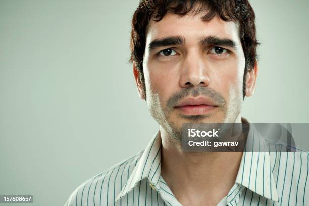 Confident Man With Strong Angular Masculine Face Looking At Camera Stock Photo - Download Image Now