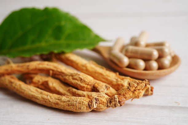 istock Ginseng roots and green leaf, healthy food. 1576091249