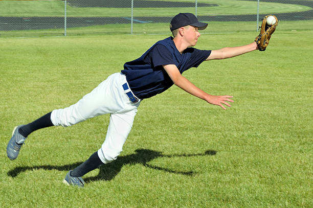 Baseball Player Makes a Diving Catch stock photo
