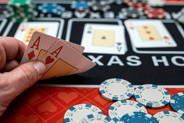 istock player is holding two ace cards - win combination at poker 1576095743