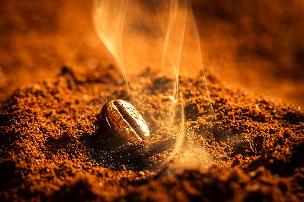 istock Close-up of a coffee bean and grinds burning 157609749