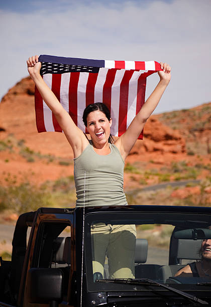 istock Young Woman Holding American Flag 157609828