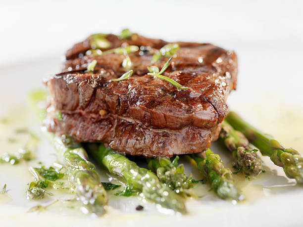 Juicy Fillet Steak with Asparagus and Garlic Herb Butter -Photographed on Hasselblad H3D2-39mb Camera