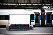 blank billboard in a train station